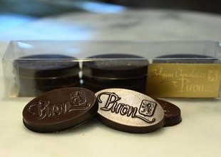 Mint infused wafers of dark chocolate in shape of oval Mint infused wafers of dark chocolate in shape of oval
